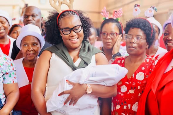 A new mom is congratulated by prayer warriors at Chris Hani Baragwanath Hospital on Christmas Day after she has delivered a bouncing baby