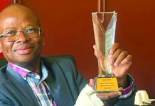DID Head of Department: Mr Rufus Mmutlana holding the Batho Pele Award