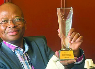 DID Head of Department: Mr Rufus Mmutlana holding the Batho Pele Award