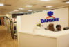 A person sits at the front desk of Dangote Headquarters in Lagos