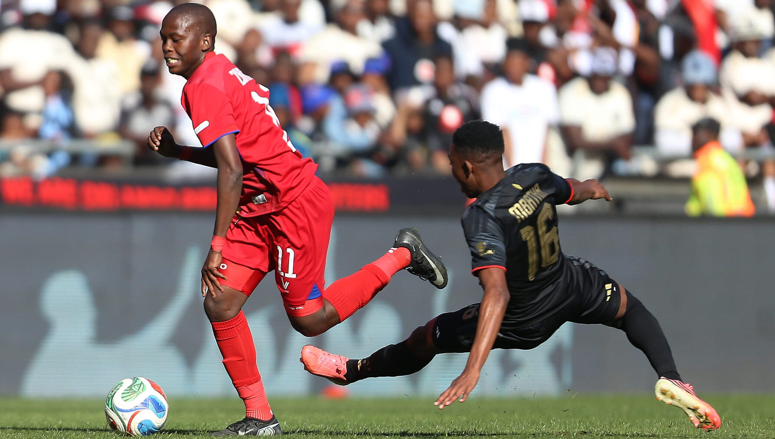 Mvelo Zikakayo of Milford FC and Thalente Mbatha of Orlando Pirates duel for the ball during a Betway Premiership match.