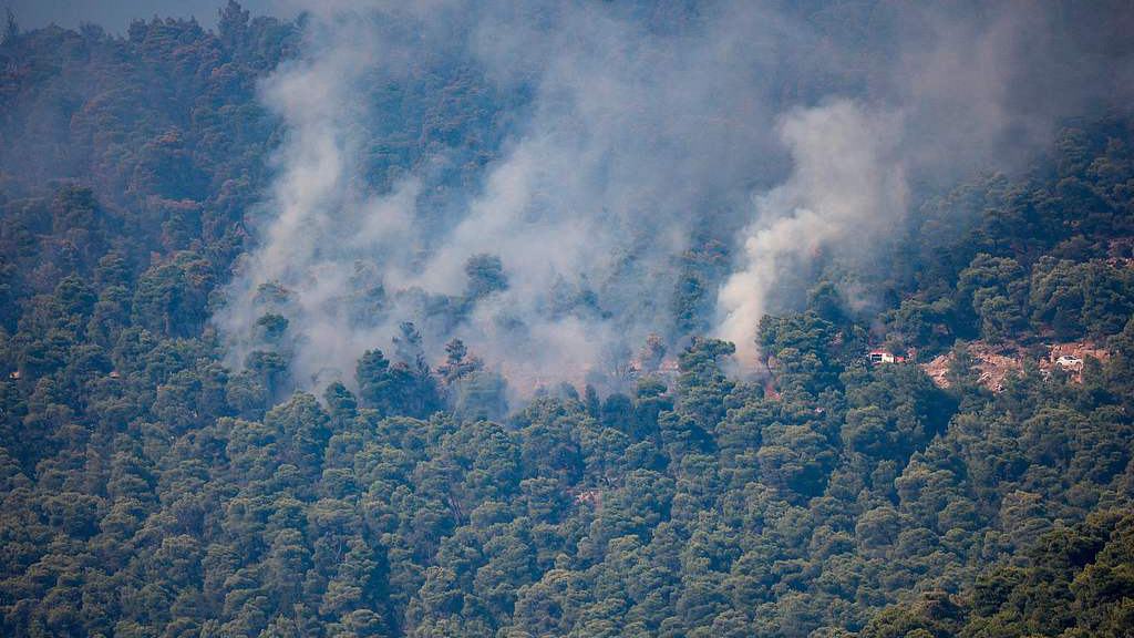 Two die in helicopter crash in Greece, as wildfires ravage Europe, US