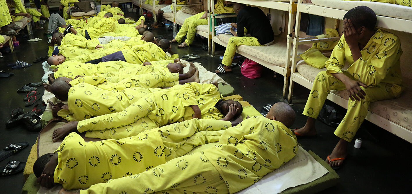 Awaiting-trial prisoners lying on beds in an overcrowded cell at Westville Prison in Durban