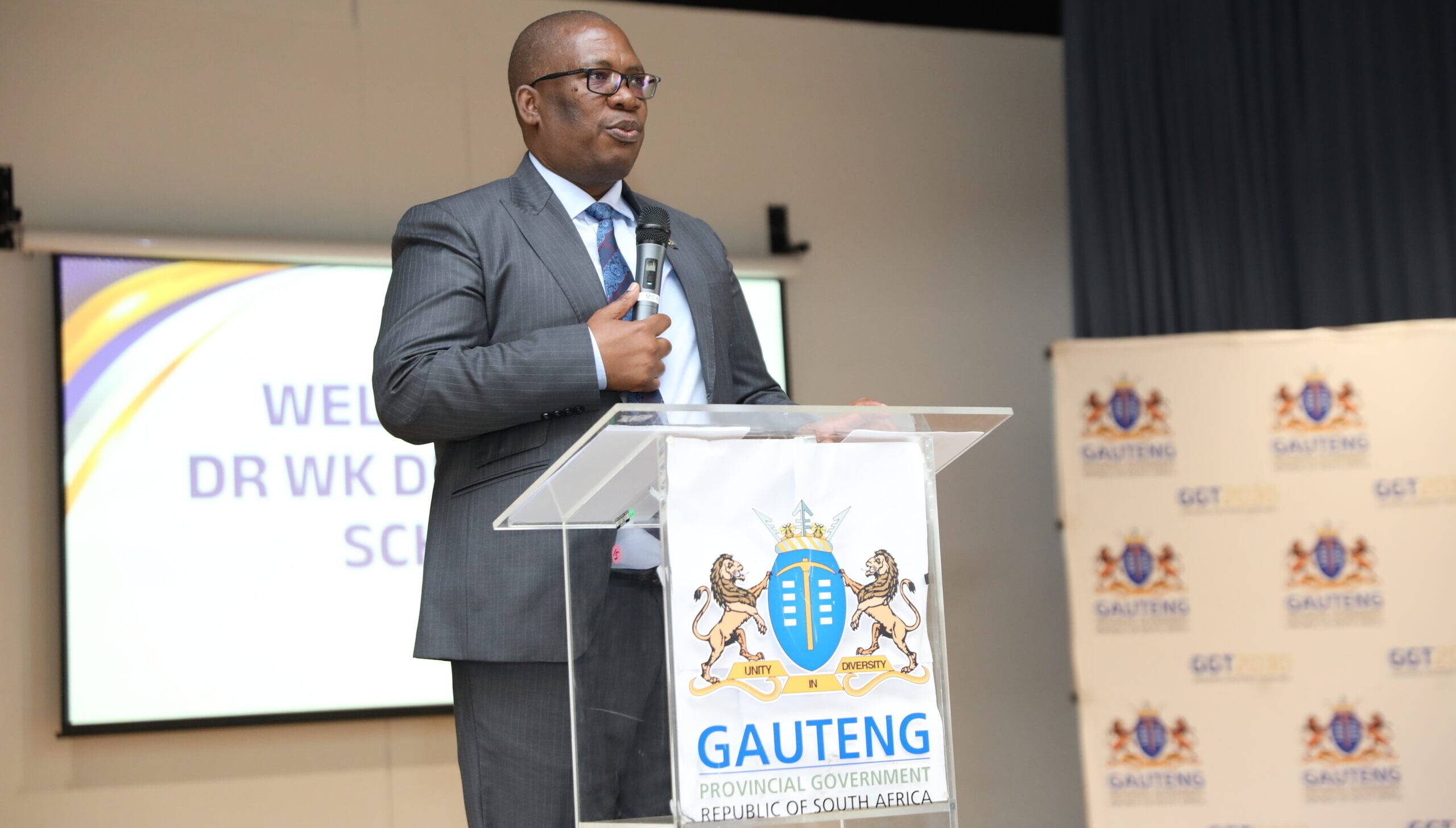 Gauteng Premier Panyaza Lesufi addressing guests at an infrastructure launch podium