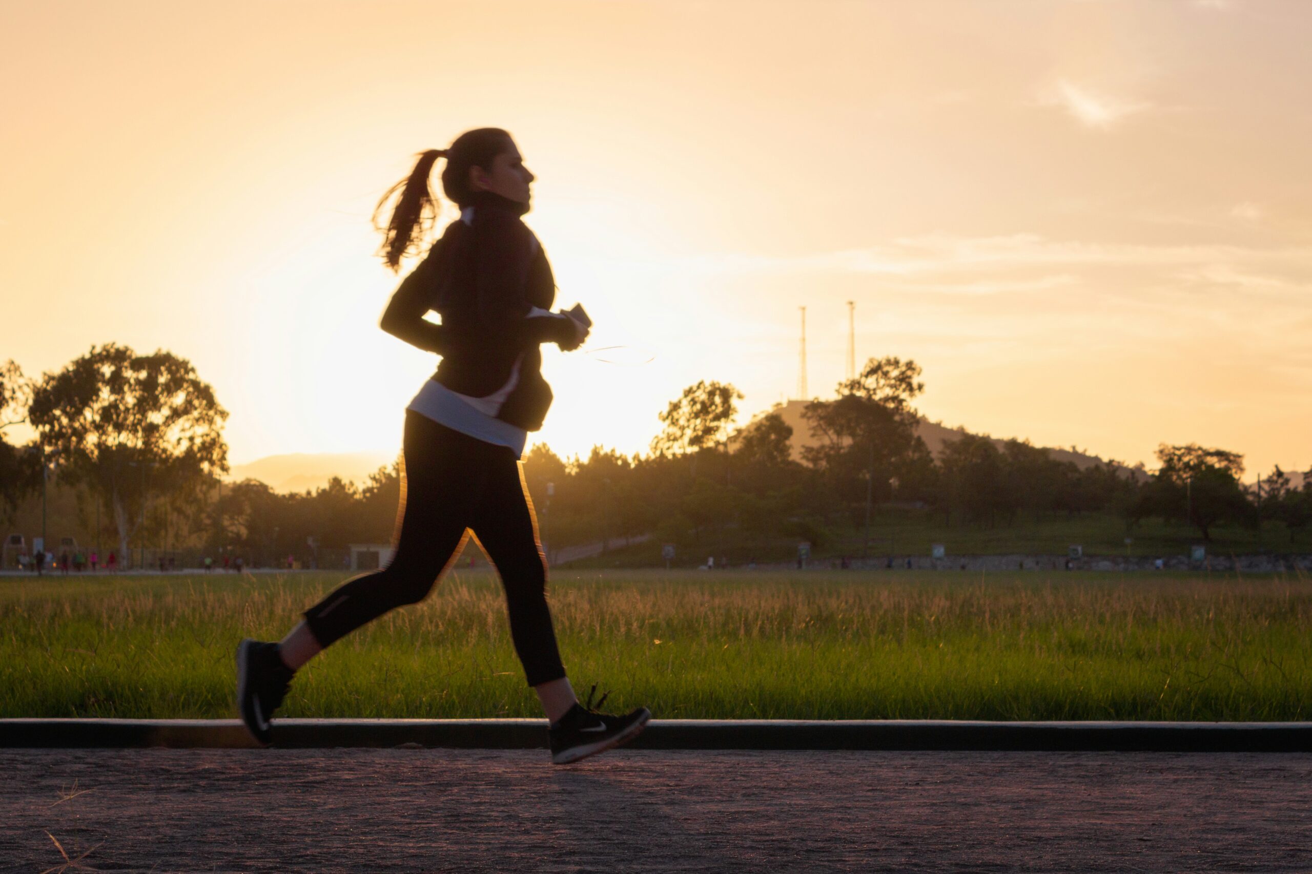 Woman jogging alone outdoors while exercising.